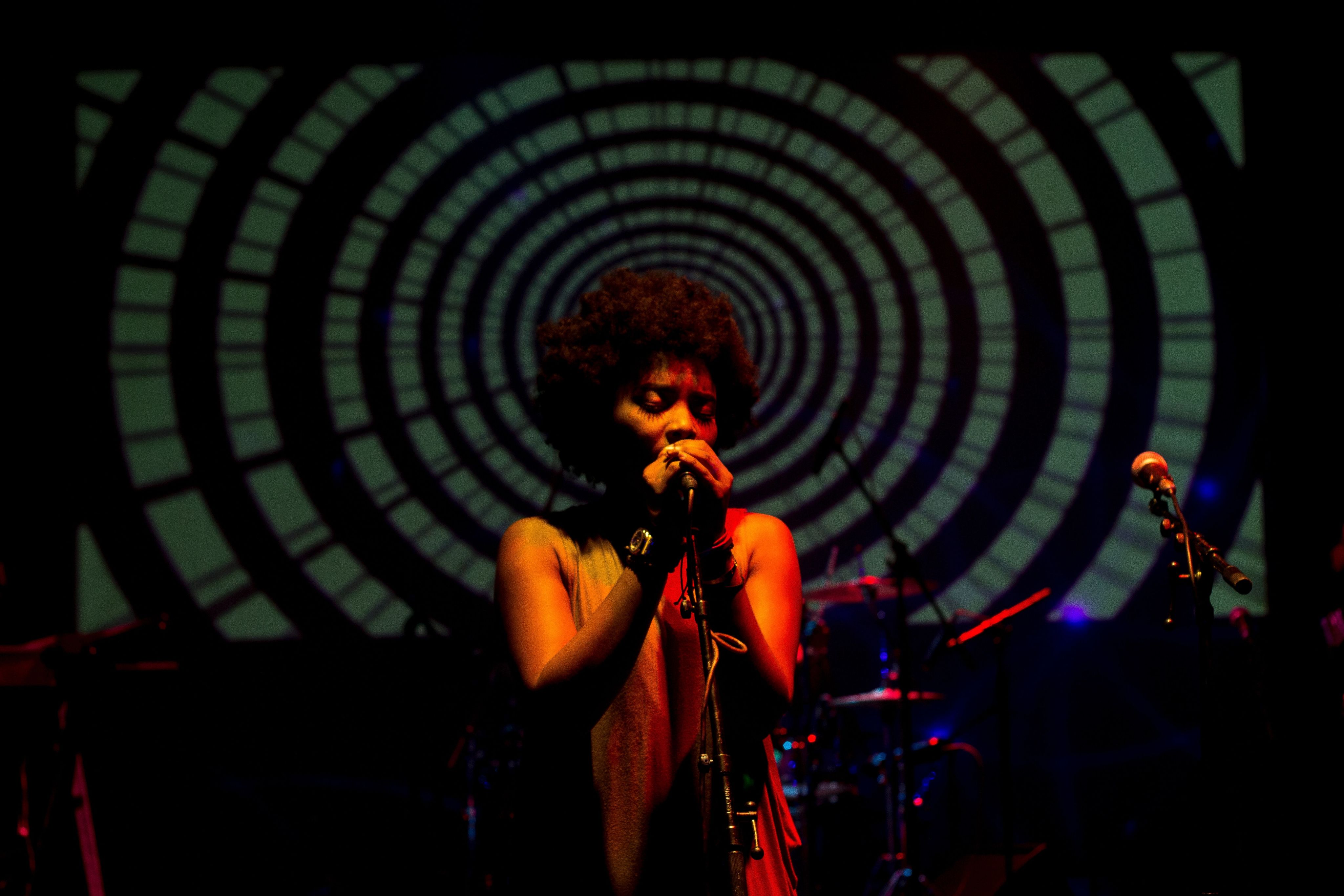 woman singing on stage