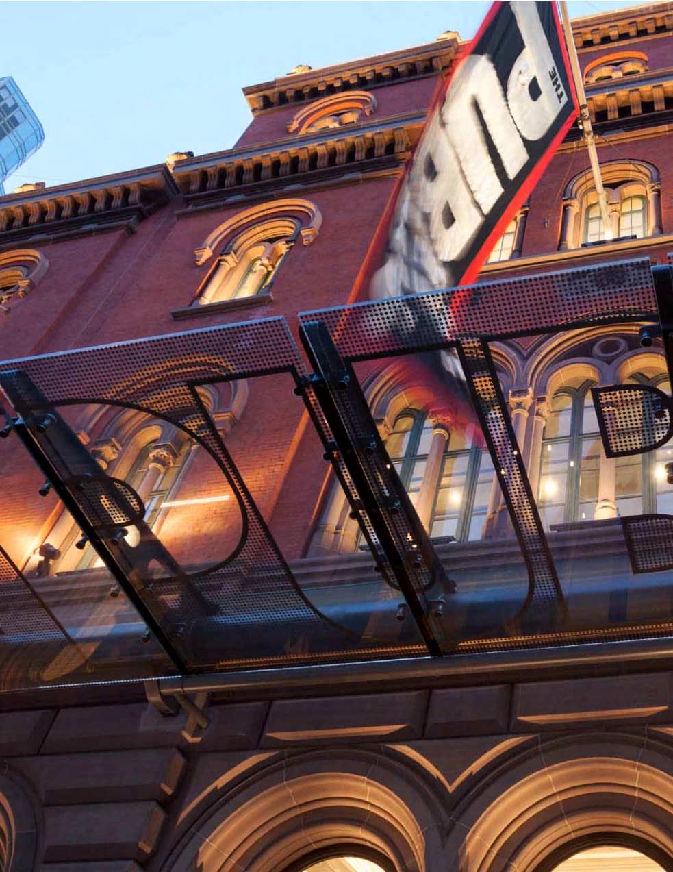 photography of people sitting on theater during nighttime