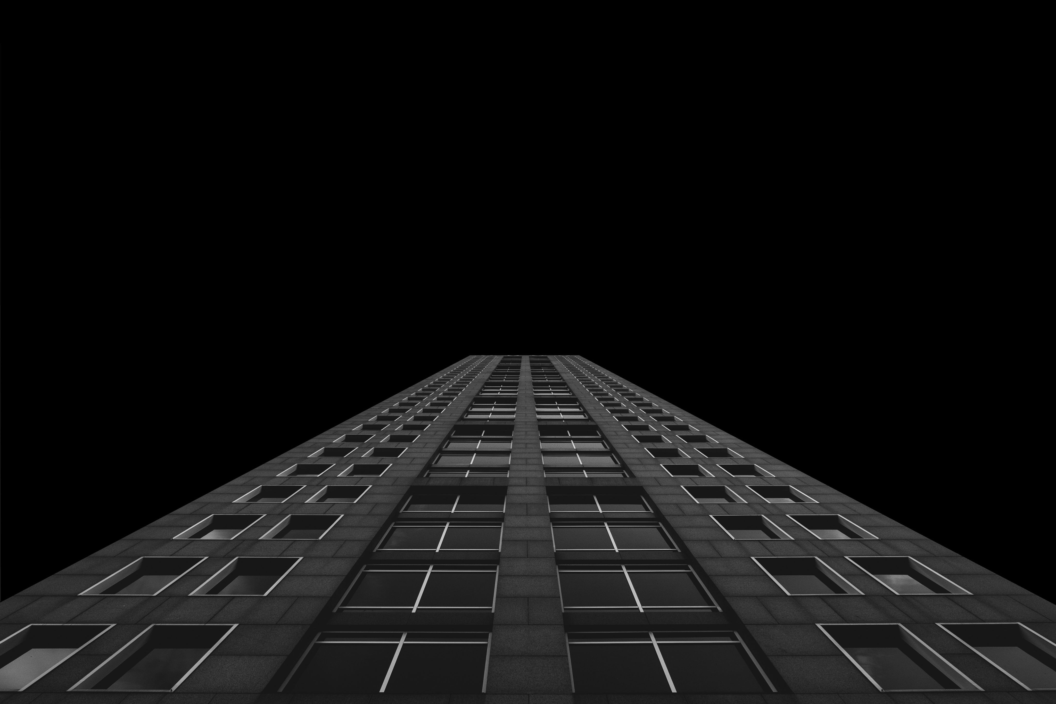 worm's eye view photo of building during night time