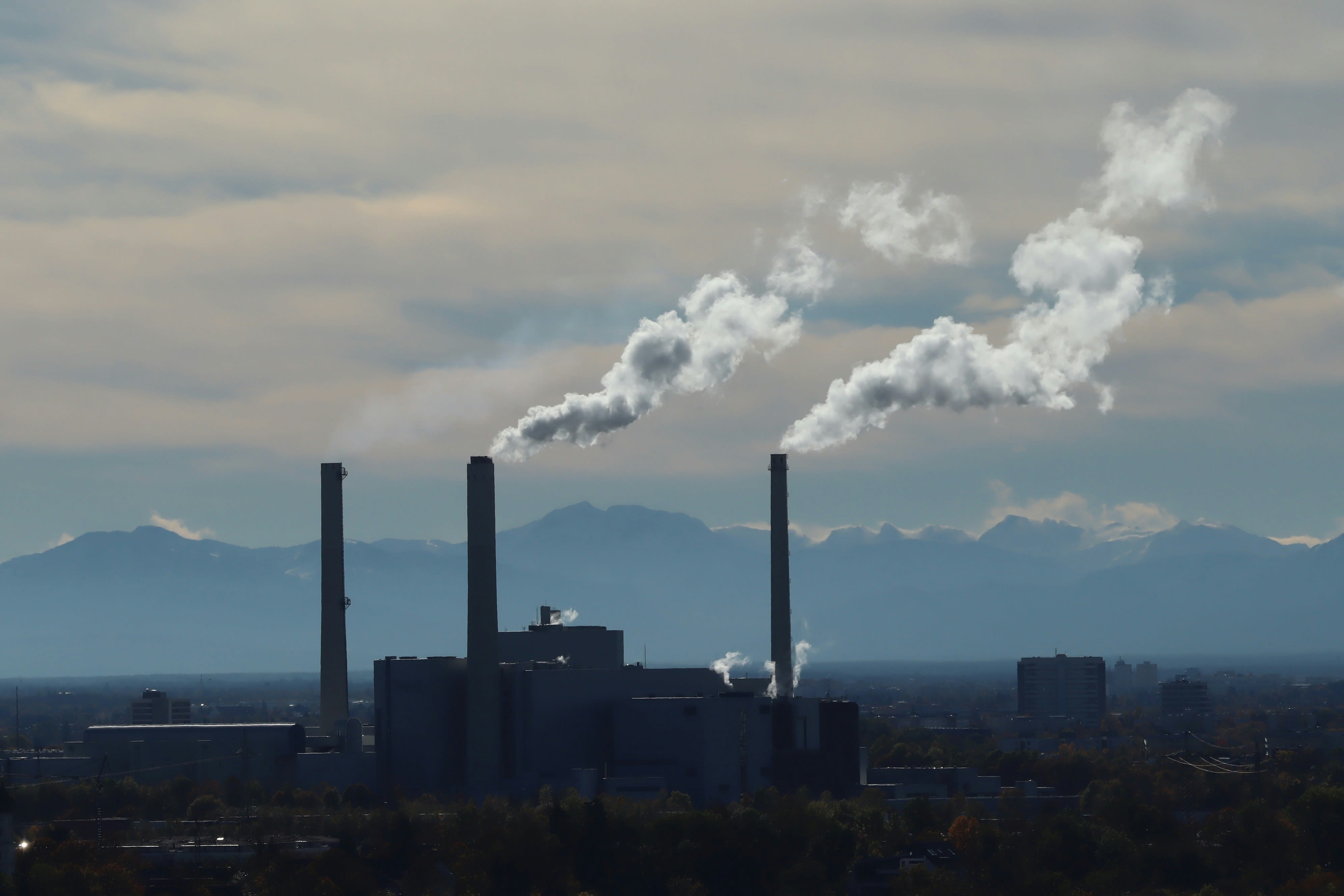 A factory with smoke coming out of it's stacks