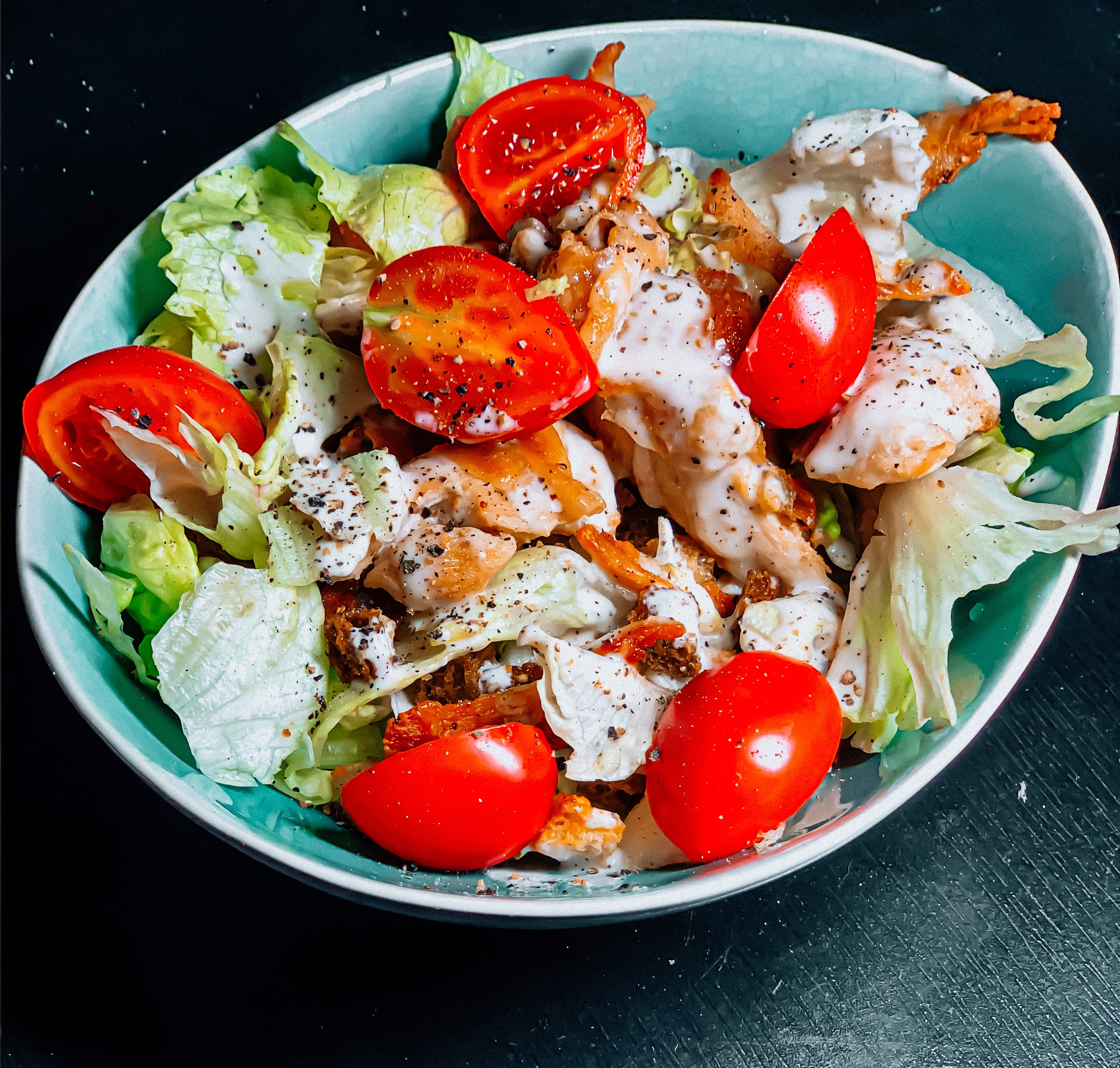 vegetable salad on blue ceramic bowl