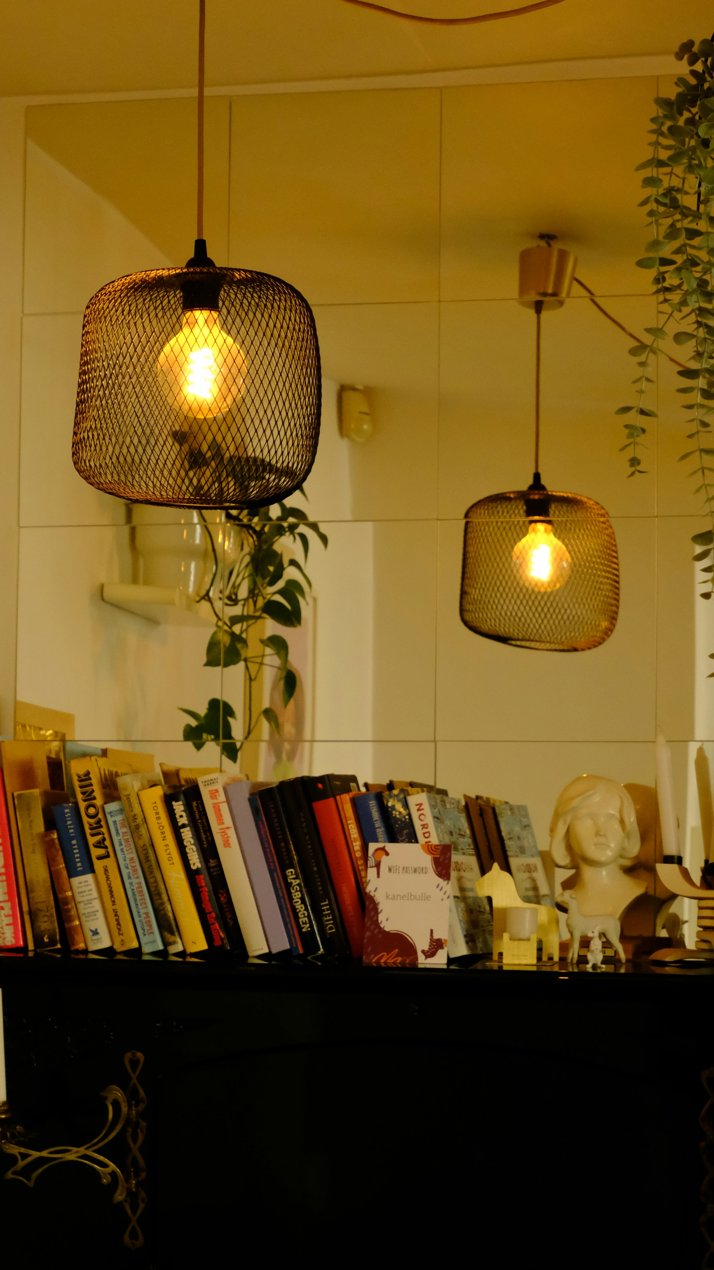 a couple of lights hanging from a ceiling