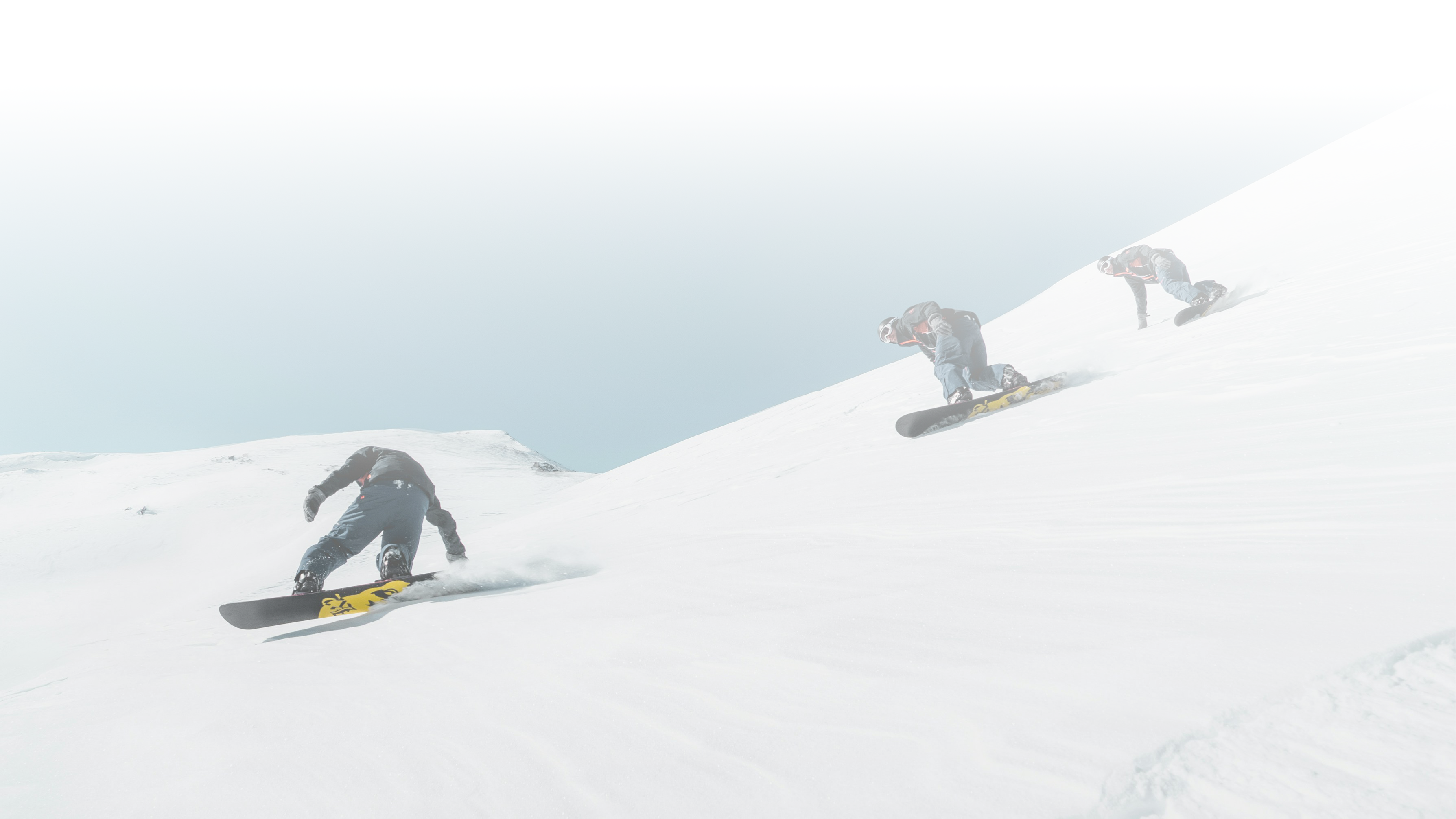 person standing on white snow cliff