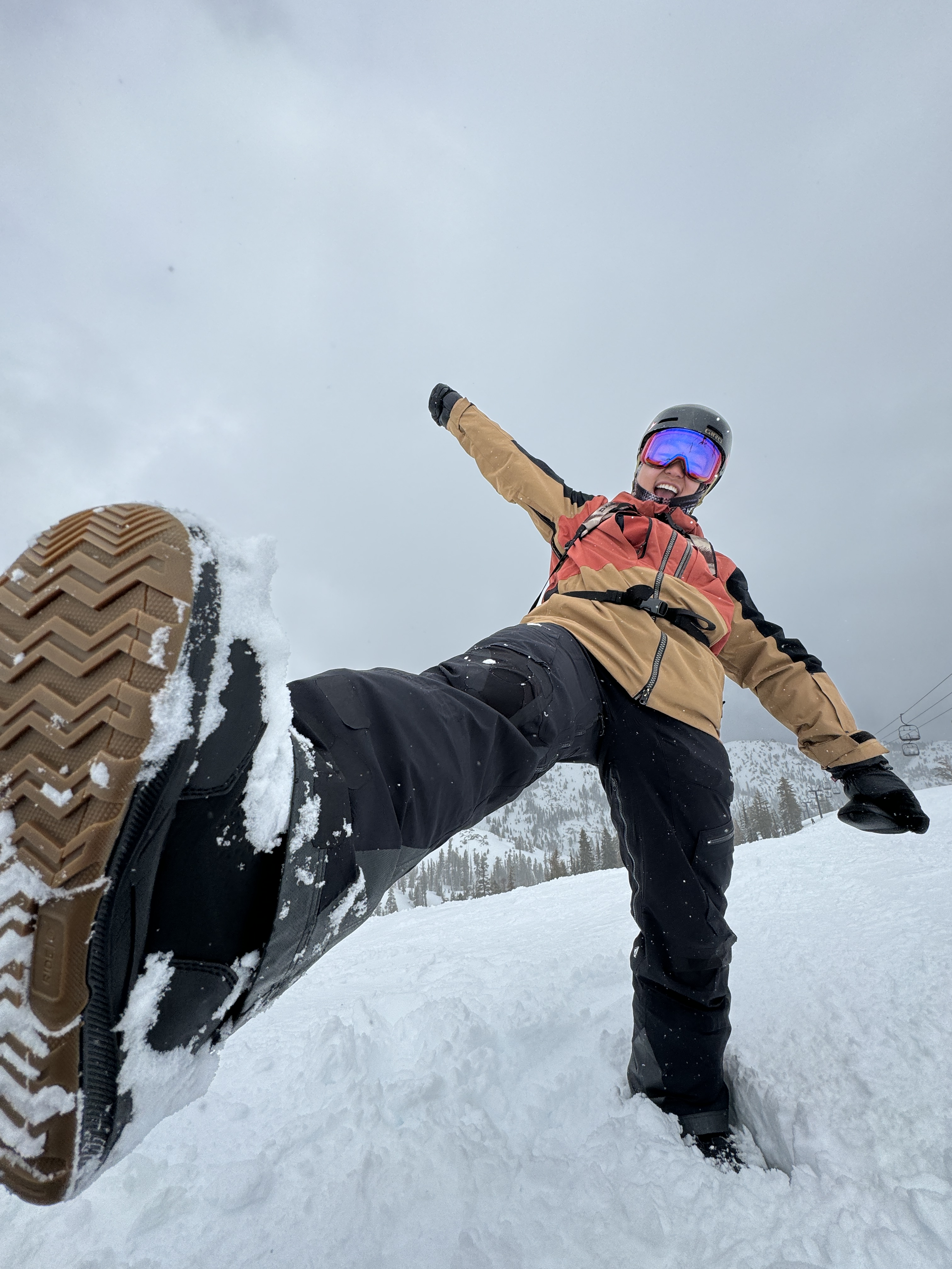 black asphalt road between snow covered ground during daytime