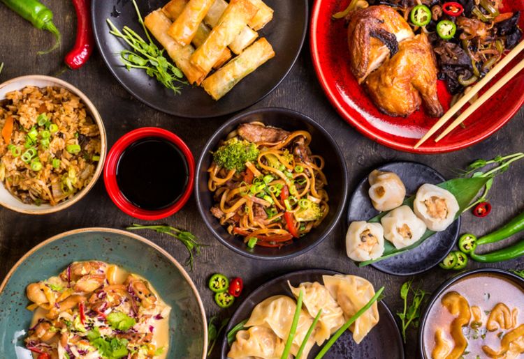 cooked food on black ceramic plates