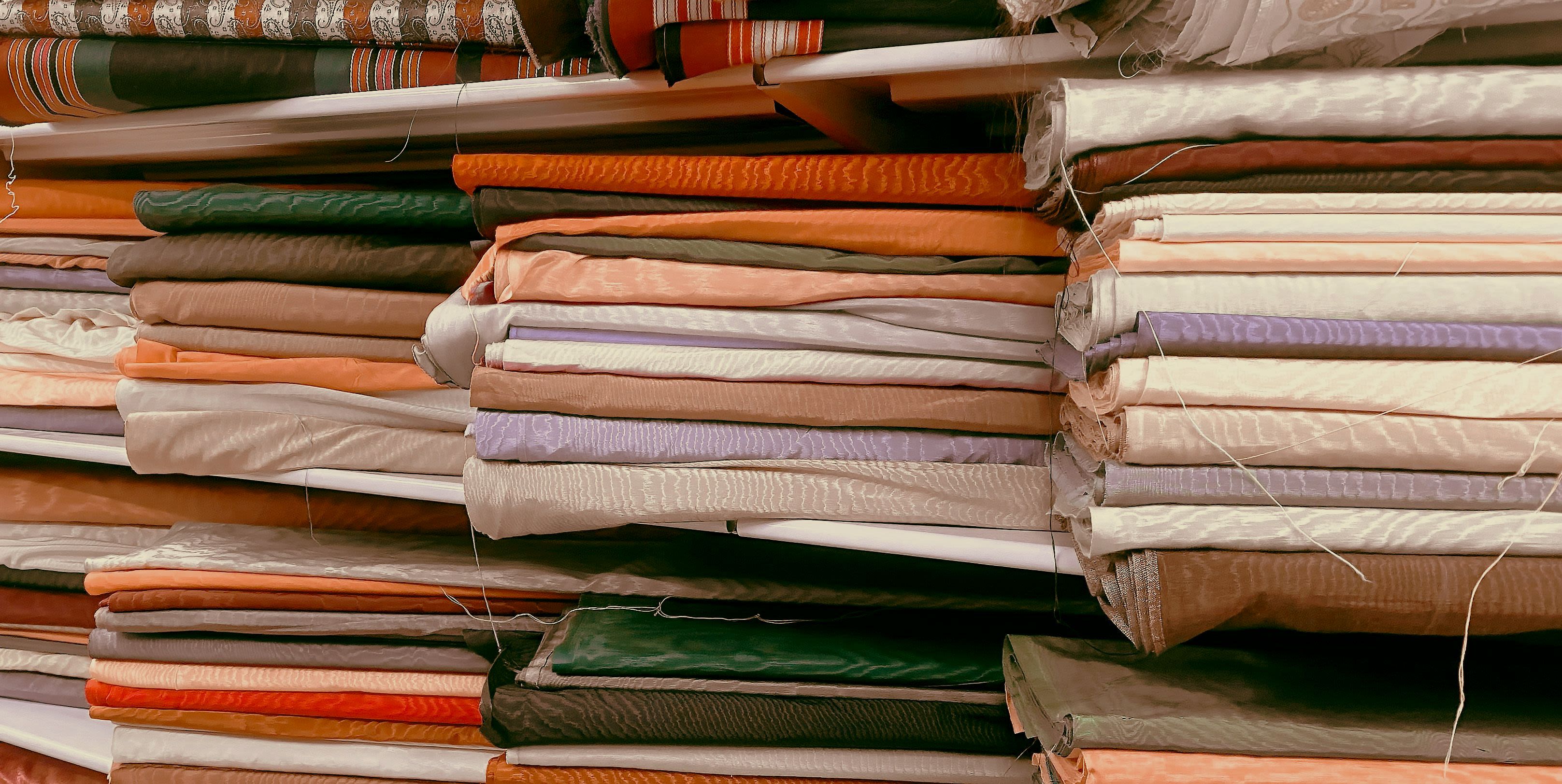 a pile of folded clothes sitting next to each other